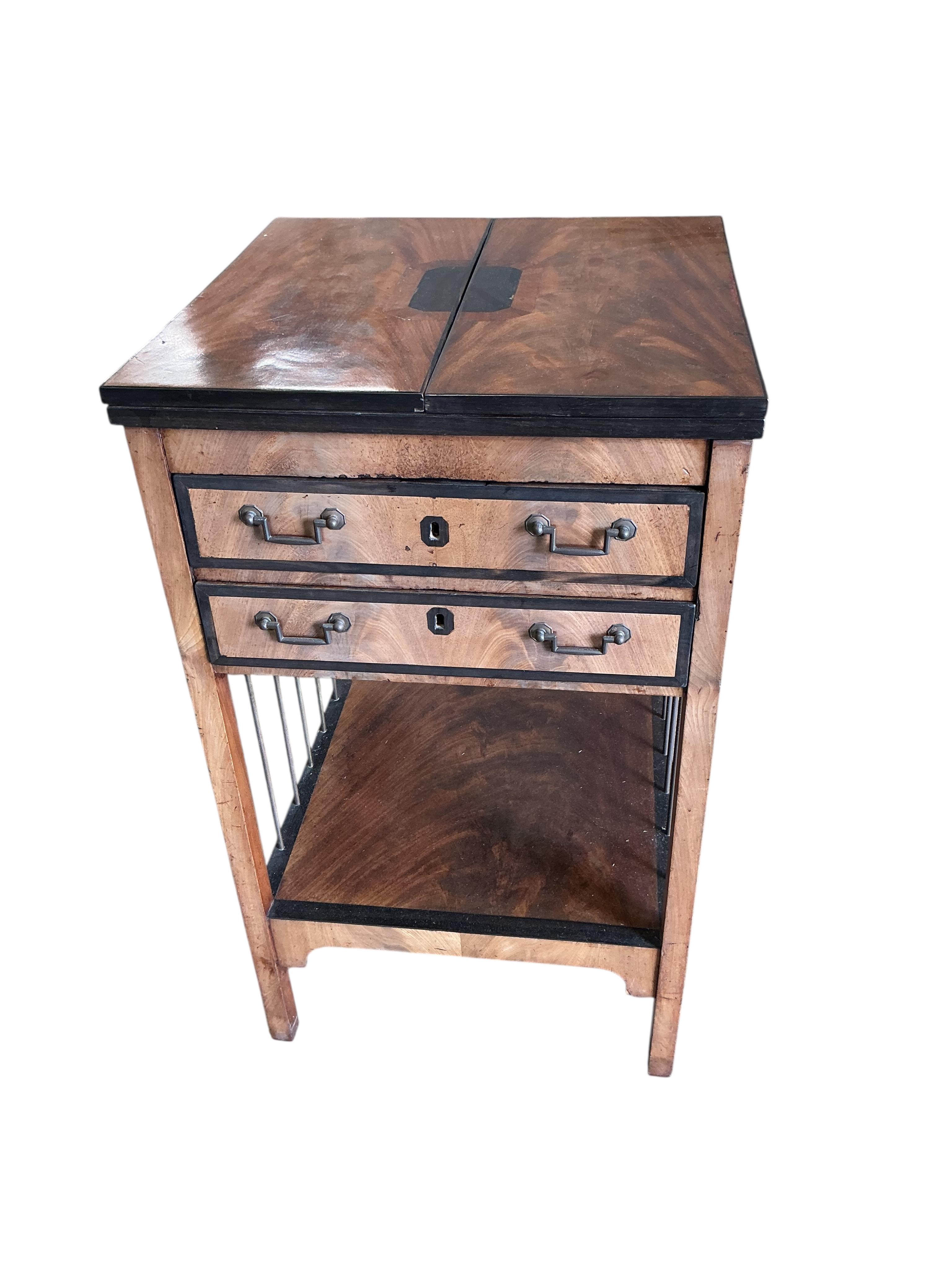 A George III ebony banded mahogany two drawer writing table, with leather lined twin flap top, width 48cm, depth 47cm, height 81cm
